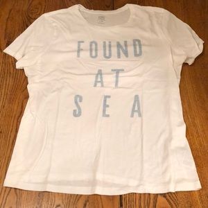 White tshirt. “Found at Sea”